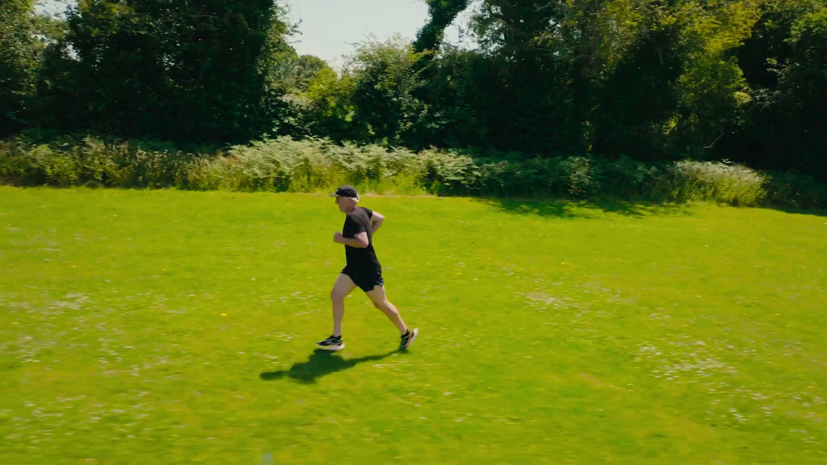Pete running across an open field