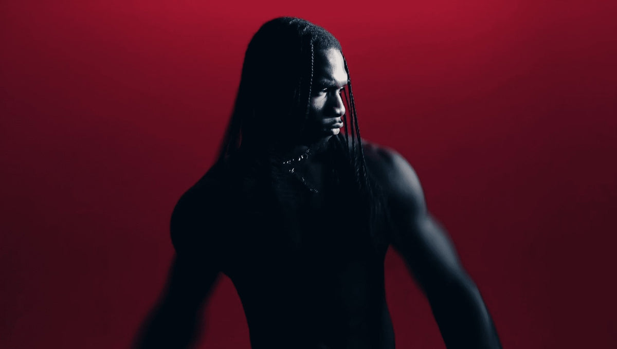 Athlete against a deep red backdrop