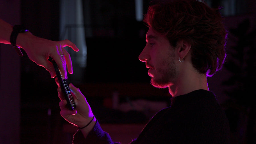 Phone glowing in a dark room